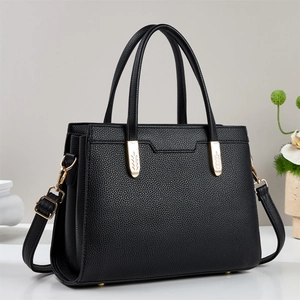 Chic black litchi pattern leather tote bag with gold leaf hardware and shoulder strap
