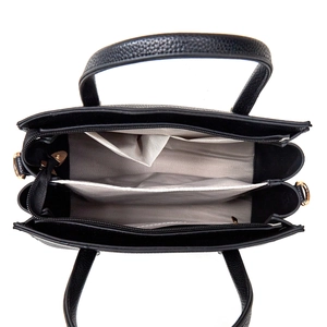 Top view of black pebbled leather bag showing organized interior and herringbone lining
