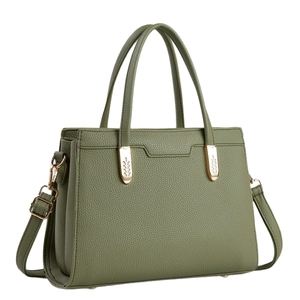 Olive green pebbled leather tote bag with gold leaf accents and adjustable shoulder strap