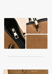 Detail of canvas tote bag with gold hardware, zipper, and brand logo stitching
