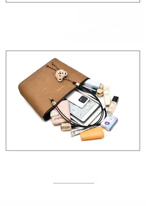 Interior view of brown tote bag showing large capacity for tablet and wallet