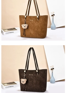 Detail showing brown and dark coffee tote bags with cute bear pendant and textured finish