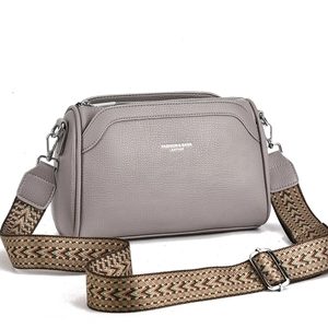 Gray lychee grain leather crossbody bag with ethnic style woven wide shoulder strap