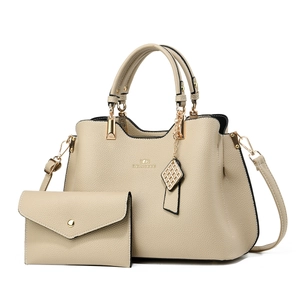 Elegant beige two-piece handbag set featuring a crossbody tote and matching long wallet