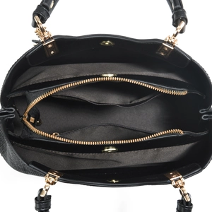 Detailed interior of black leather handbag with large compartments and gold hardware