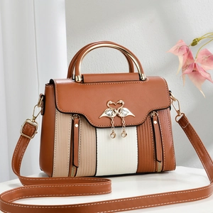 Vintage tricolor patchwork crossbody bag with swan logo and gold top handle