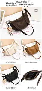 Detail of vintage moon bag showing multi-compartment interior and metal zipper