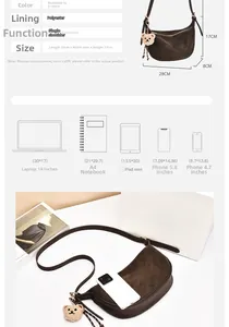 Detail of crescent shoulder bag in dark brown faux suede with dimensions and bear charm