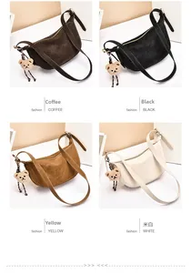 Four crescent shoulder bags in coffee, black, yellow, and white with plush bear charms