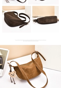 Detail of half-moon crossbody bags in brown suede with adjustable straps and bear charm