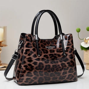 Glossy leopard print tote bucket bag with stylish silver FASHION Queen metal logo