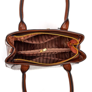 Detail view of brown crocodile texture handbag with multi-compartment interior and gold zip