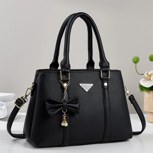 Sac à main élégant en cuir noir pour femmes avec nœud perlé et garnitures dorées