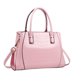 Pink crocodile-embossed leather tote bag with gold hardware and shoulder strap
