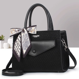 Elegant black knit leather handbag with silk scarf detail and adjustable strap