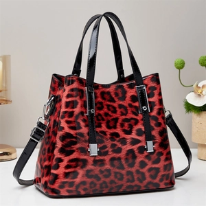 Fashionable red and black leopard print tote bag in glossy patent leather finish