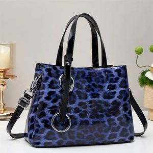 Blue leopard print tote bag in glossy patent leather with metallic ring handles