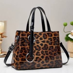 Large leopard print tote bag with glossy finish and black patent leather handles