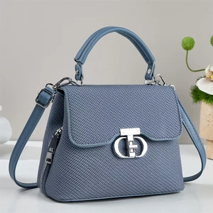 Blue denim texture handbag with silver metal lock and adjustable shoulder strap