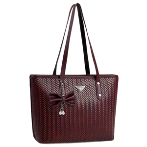 Deep wine red woven tote bag with triangular metal logo and pearl bow charm accessory