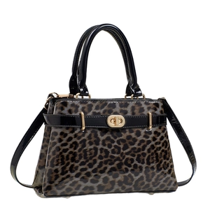 Leopard print faux leather handbag with glossy finish and golden twist-lock closure