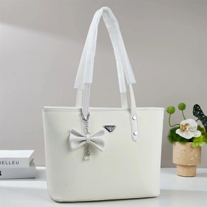 Chic white large capacity tote bag with bow and pearl charms for stylish commuting