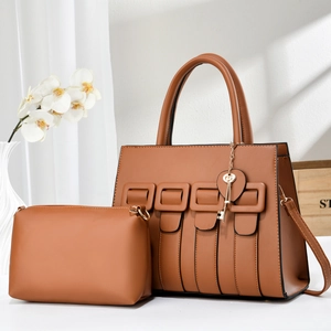 Brown woven leather tote bag set with heart key charm and matching smaller pouch