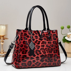 Classic red leopard print handbag with glossy finish and silver V metal buckle detail