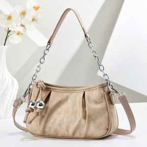 Beige pleated cloud handbag with silver chain strap and metallic ball charms