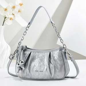 Silver metallic pleated cloud bag with stylish chain strap and elegant spherical pendant