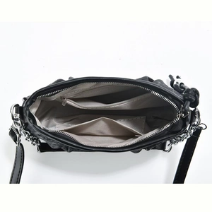 Detailed view of the black cloud bag's interior featuring lining, zipper pocket and slot pockets