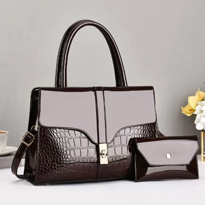 Deep brown patent leather tote bag set with crocodile texture and gold hardware