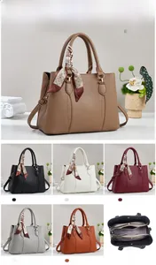 Detail view of large tote bag dimensions with internal compartments and scarf handle