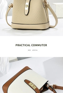 Close-up of metal turn-lock and adjustable strap detail on chic commuter bucket bag