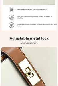 Macro view of cream textured leather handbag with gold metal twist-lock and fine stitching