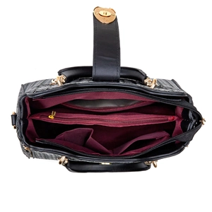 Luxury black woven texture handbag featuring a deep burgundy dual-compartment interior
