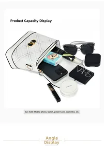 Interior view showing the large capacity of the white quilted bucket bag with gold hardware