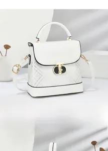 Detail of white leather handbag showing gold twist lock and grey plaid pattern base