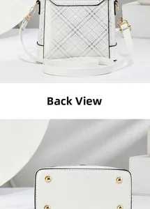 Detail showing the white checkered pattern back view and gold protective feet of the bag