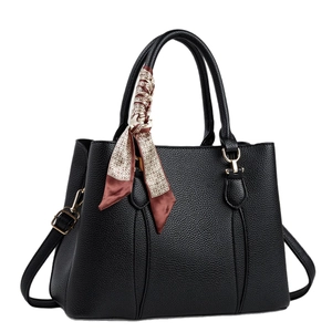 Black litchi grain tote bag with geometric silk scarf detail and golden metal hardware