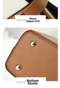 Detail view of gold hardware zipper and protective base rivets on brown leather bucket bag