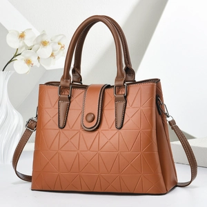 Brown faux leather handbag with geometric triangle embossing and adjustable strap