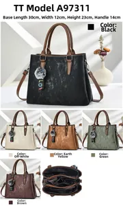 Detailed view of large capacity vintage tote bag featuring multiple internal zipper compartments