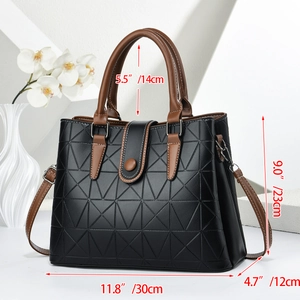 Detail of black leather handbag with geometric texture and dimensions in inches and cm