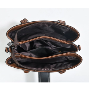 Top view showing the spacious interior with multiple compartments and zippers of the tote bag