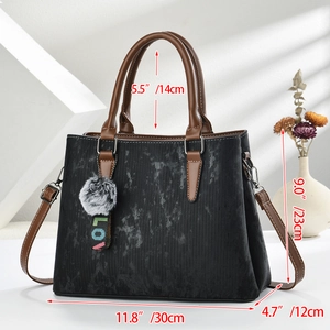 Detailed dimensions of a vintage suede Boston bag with brown leather straps and plush charm
