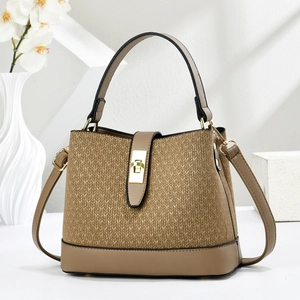 Elegant khaki woven texture bucket bag with gold hardware in a modern interior setting