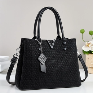 Elegant black knit handbag with metal V logo, leather handles and adjustable shoulder strap