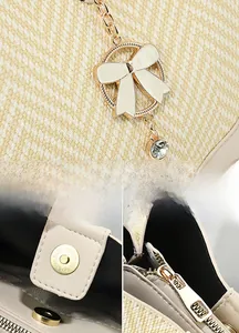 Detail of cream woven handbag showing golden magnetic closure and bow charm hardware
