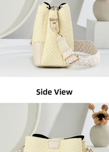 Detailed side view of bucket bag showing textured weave and adjustable patterned strap